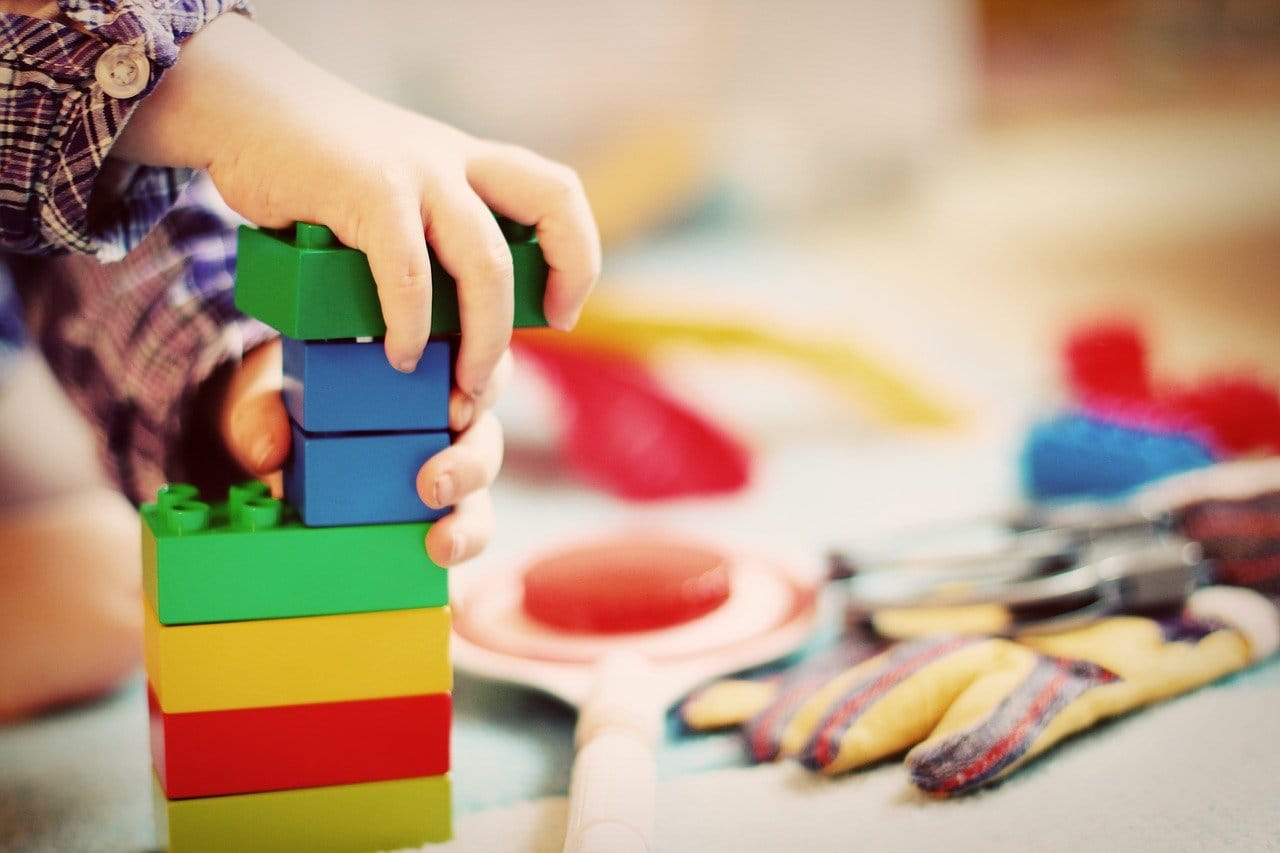 Child playing with building blocks